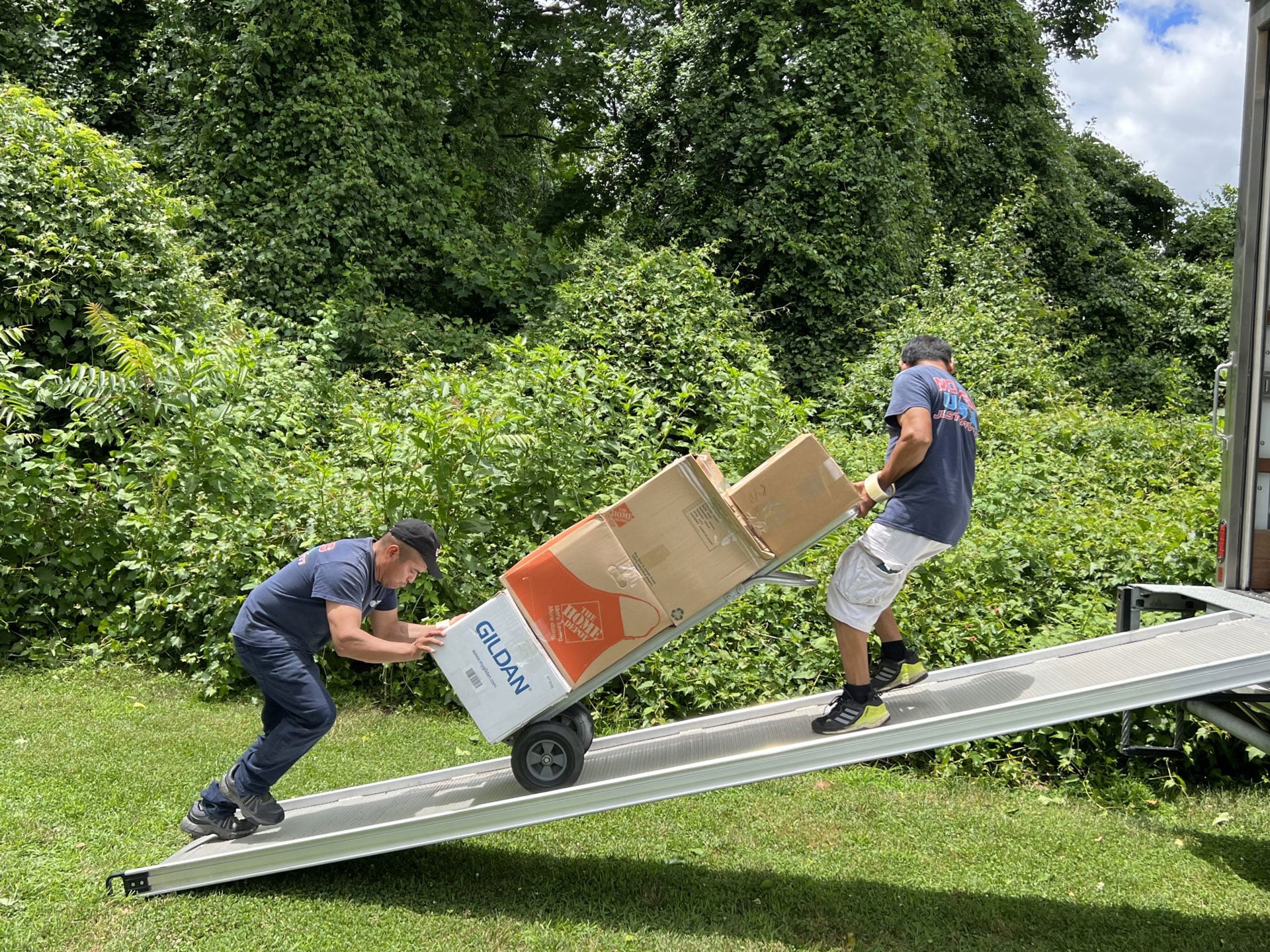 Movers USA crew packing household items