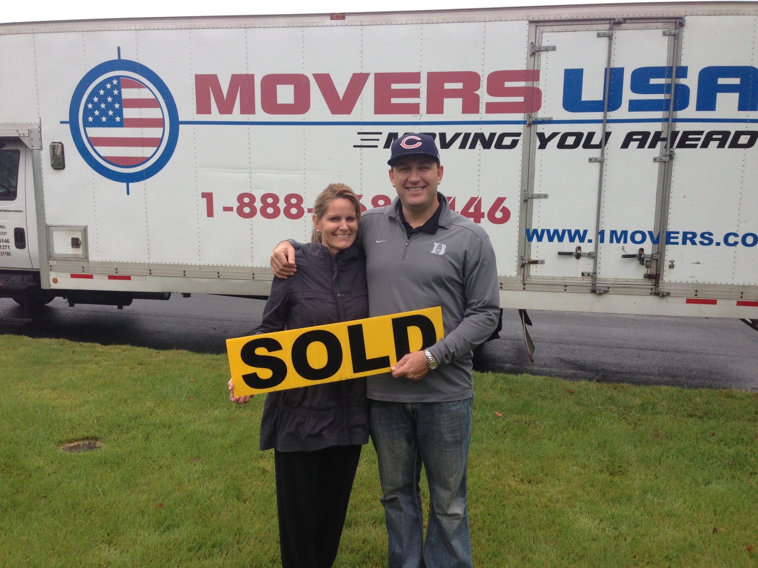 Movers USA truck at home with sold sign