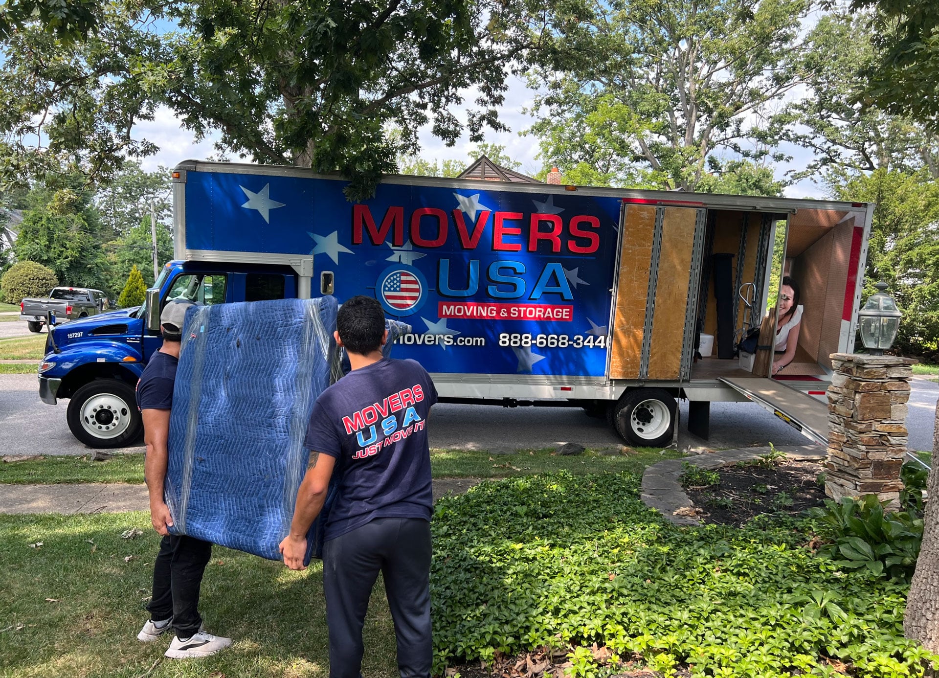 Movers USA branded moving truck and movers
