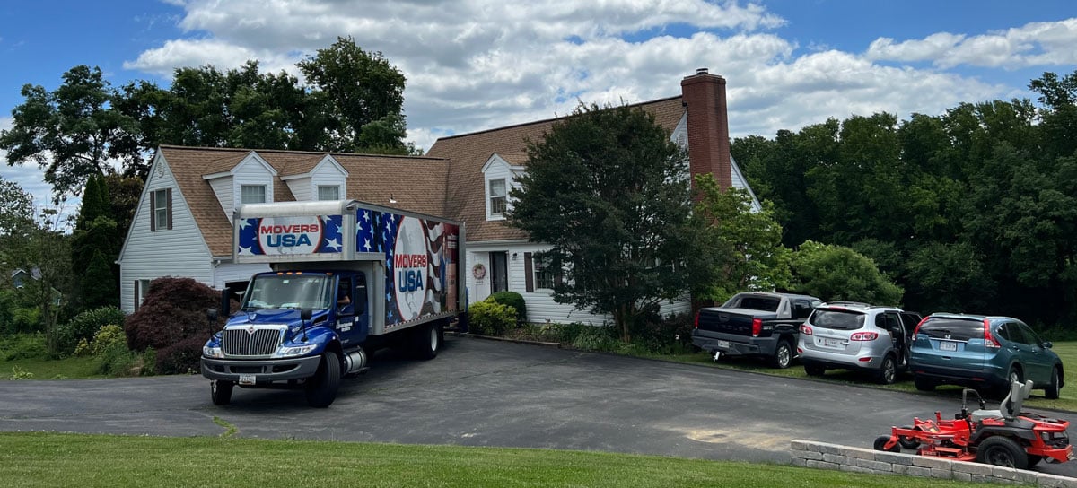 Movers USA truck parked on residential street